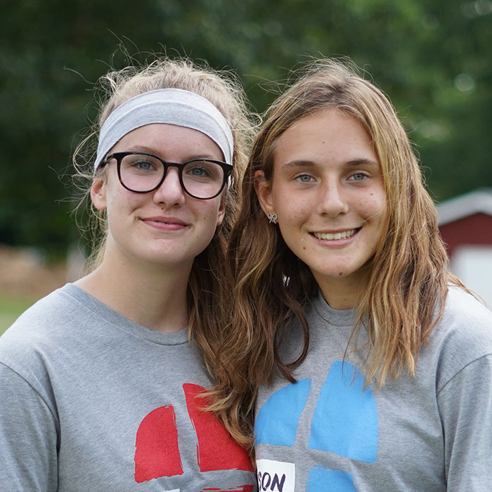 Two friends pose together